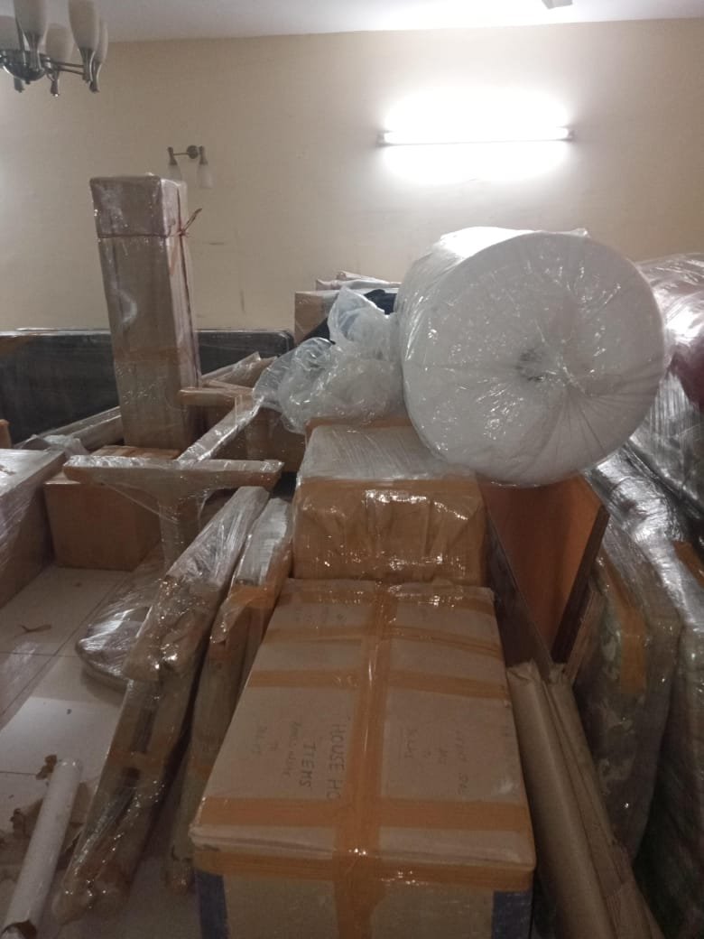 Packers carrying packed furniture safely